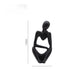 Black abstract resin meditator figurine with a 13 cm height marker on a plain background