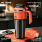 Orange insulated stainless steel travel mug with flip lid and side handle on a kitchen counter