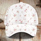 Structured baseball cap with a dense flower print wrapping the crown and brim