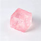 Translucent pink cheese cube squishy toy with moulded holes
