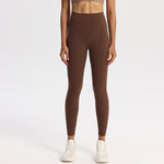 High-waisted nylon and spandex yoga leggings for women, shown on a studio model