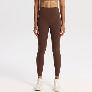 High-waisted nylon and spandex yoga leggings for women, shown on a studio model