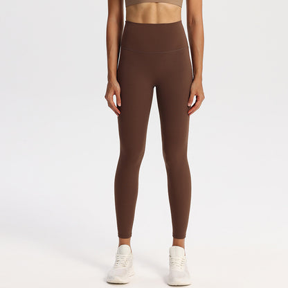 High-waisted nylon and spandex yoga leggings for women, shown on a studio model