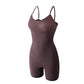 Coffee brown seamless shaping cami bodysuit shown laid flat with adjustable straps and short legs