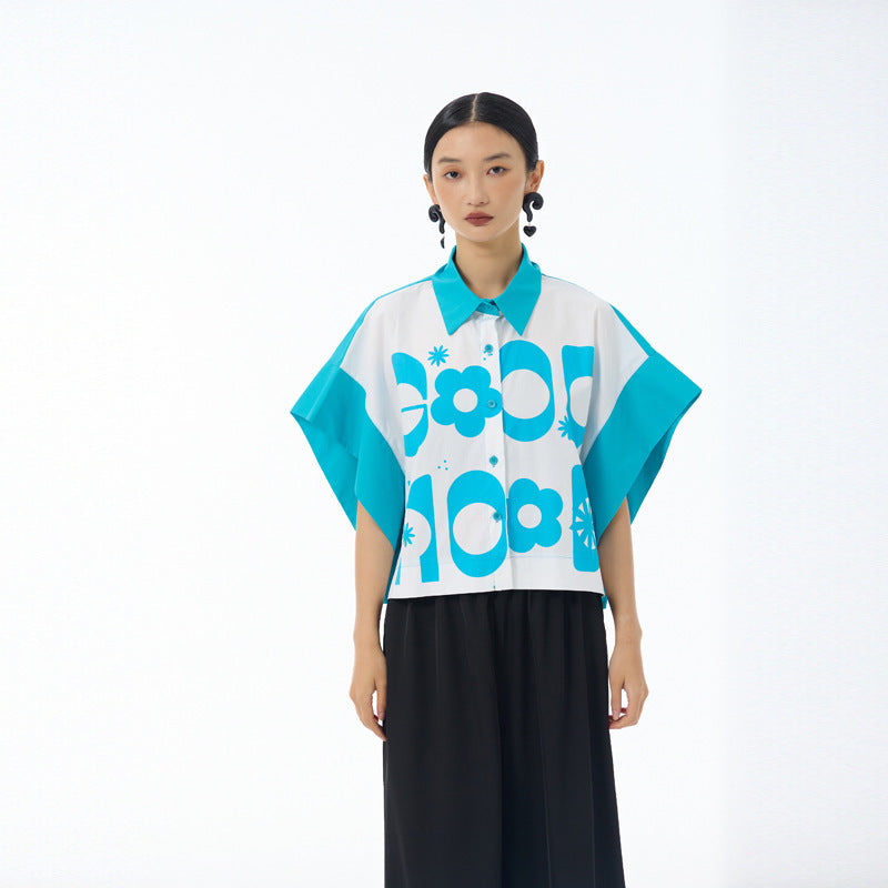 Sky blue color blocked cropped shirt showing wide batwing sleeves and front placket