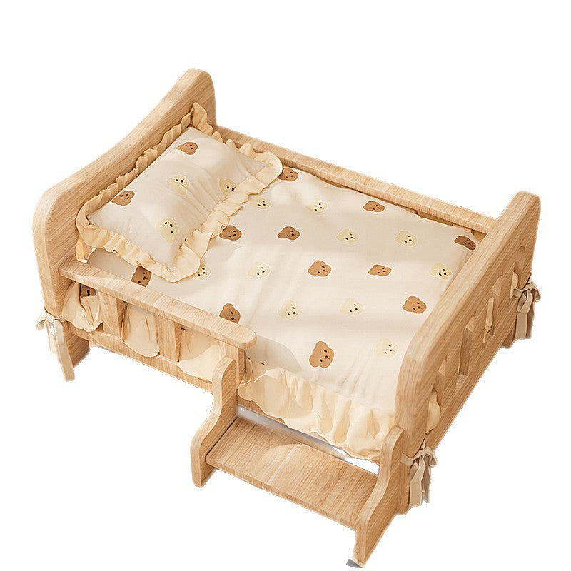 Solid wood pet bed with ruffled bear print bedding, pillow and front step on a white background