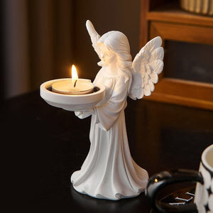 Side profile of the angel tealight holder showing the carved feather wings