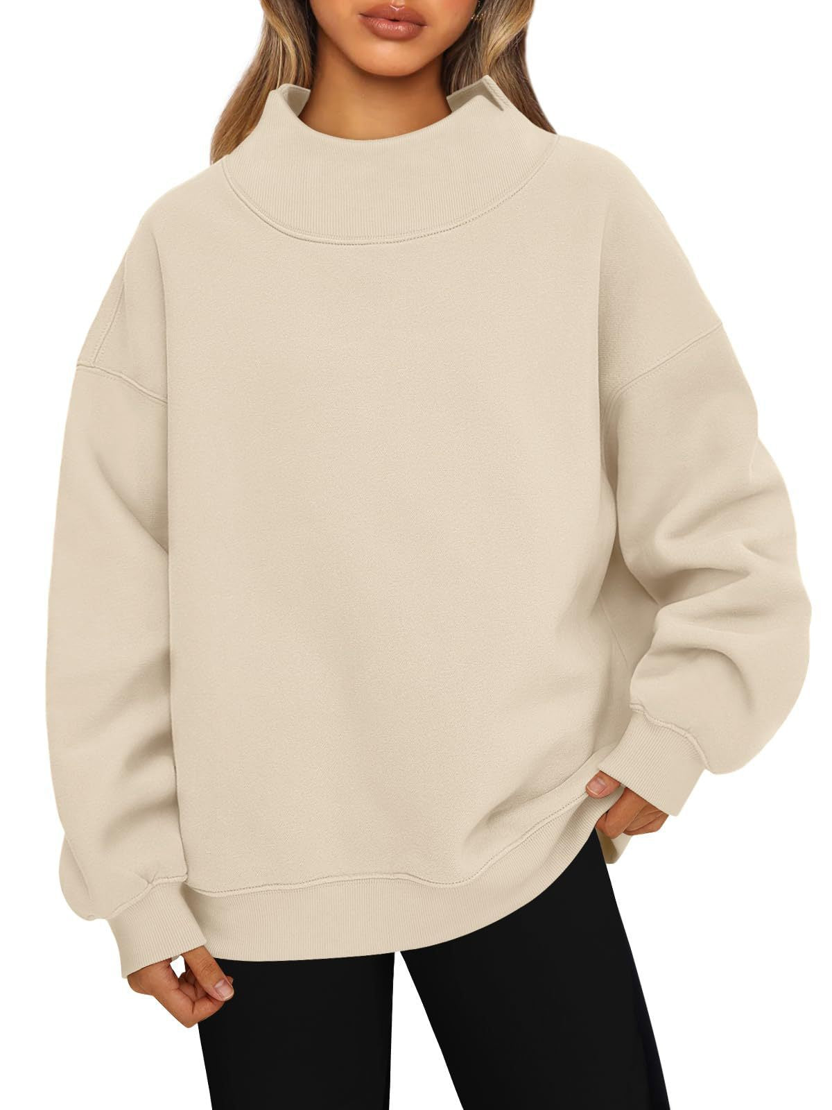 Beige oversized mock neck sweatshirt with ribbed cuffs and hem, worn with black leggings, photo for size L