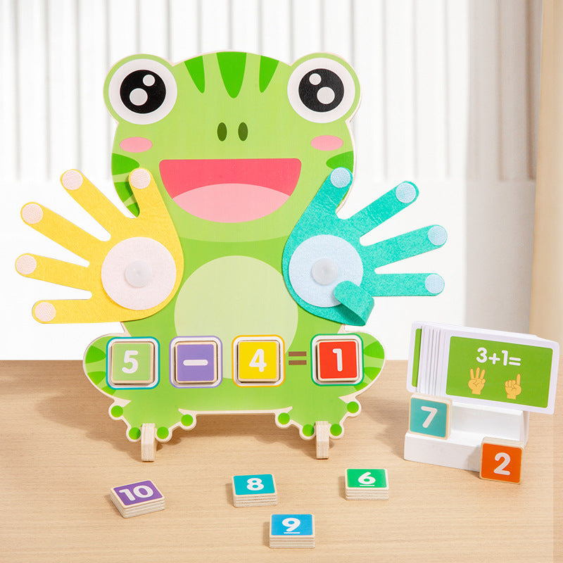 Green frog shaped finger math board with yellow and teal felt hands, a 5 minus 4 equals 1 sum and a card stand