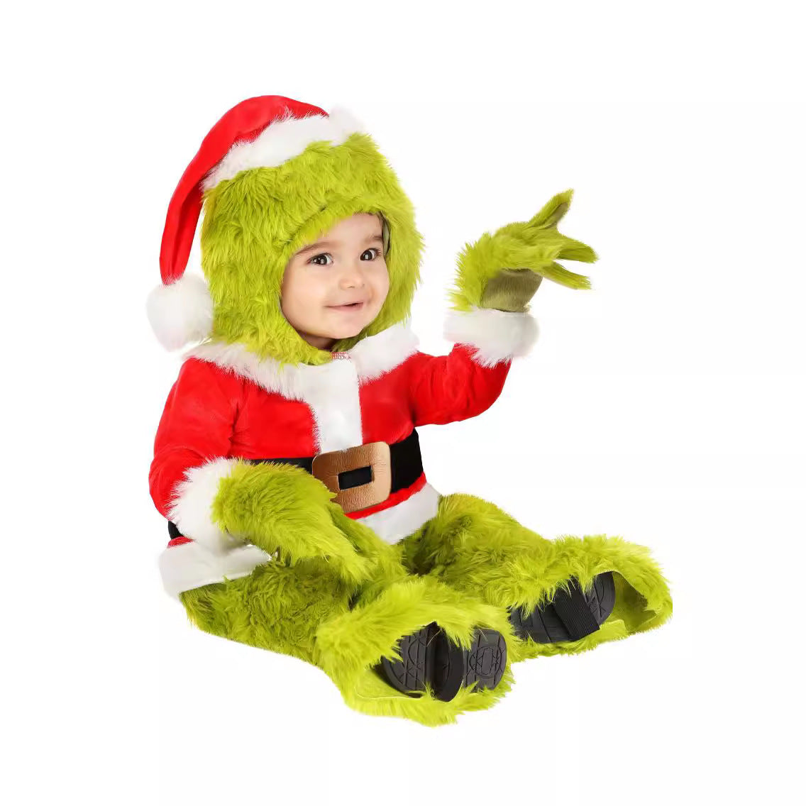 Toddler sitting in the green fur and red Santa costume with a Santa hat on a green fur hood
