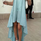 Jade Green asymmetrical hem dress worn on a warm casual day, bare shoulders