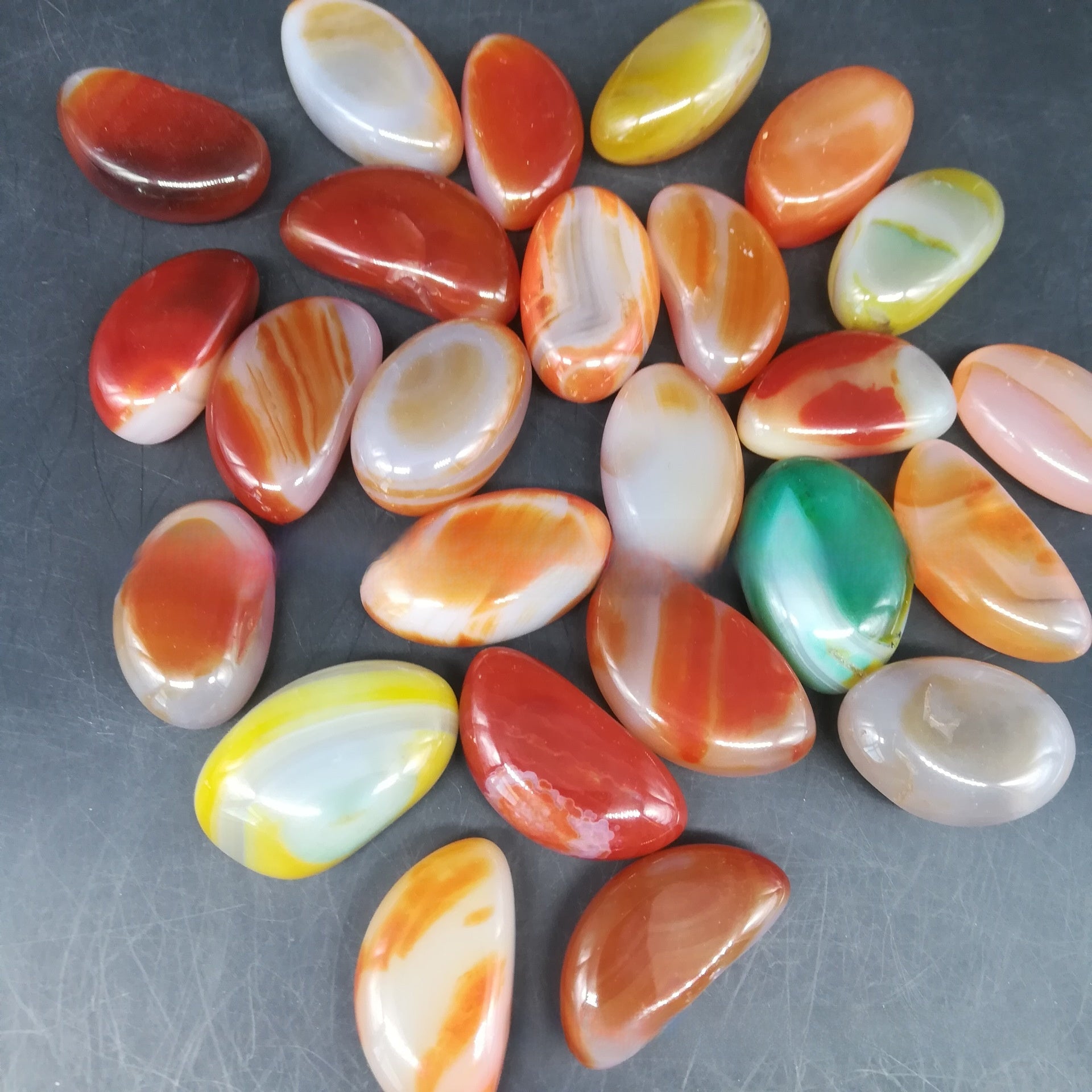 Colour enhanced blue agate decorative pebbles in a loose display lot