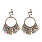 Bohemian vintage clip-on tassel drop earrings on a zinc alloy frame, handmade boho pair on white studio background