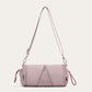 Purple cylindrical nylon crossbody bag with stitched front lines and silver hooks, variant image for the purple color