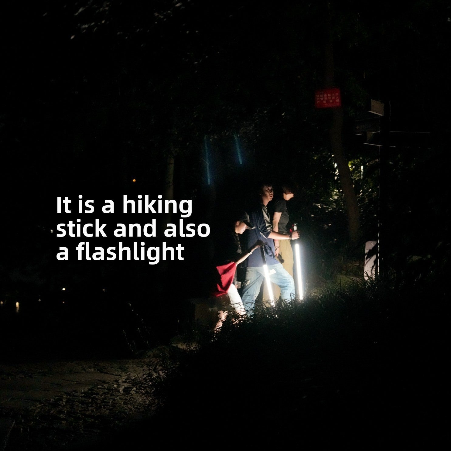 Rechargeable LED trekking pole with its illuminated white glowing shaft on a dark background