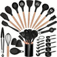 Black silicone kitchen utensil set with beech handles arranged in an arc around the matching crock