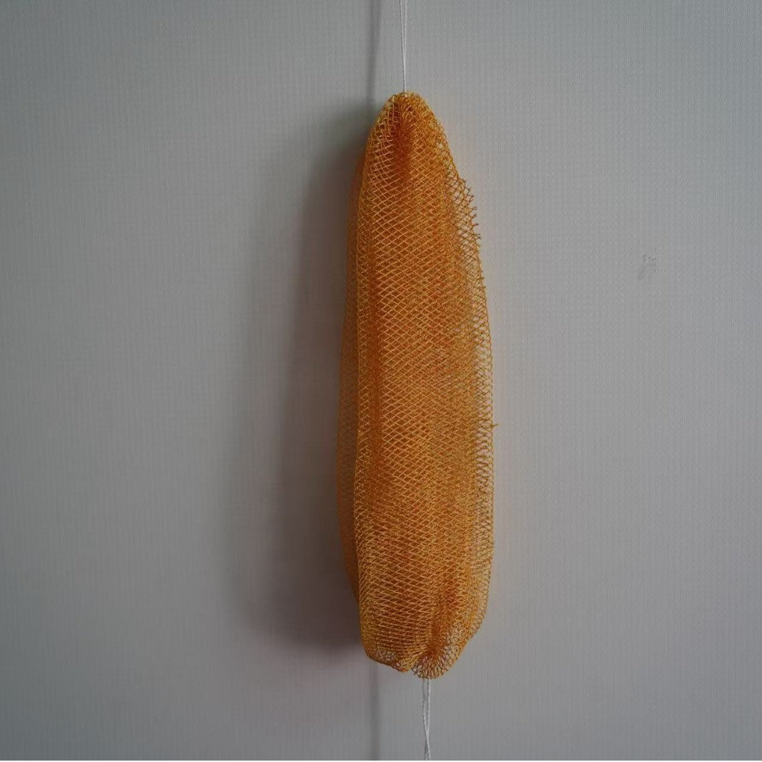 Single exfoliating net bath scrubber strip laid flat