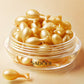 Gold Sadoer facial essence capsules filling a clear round jar