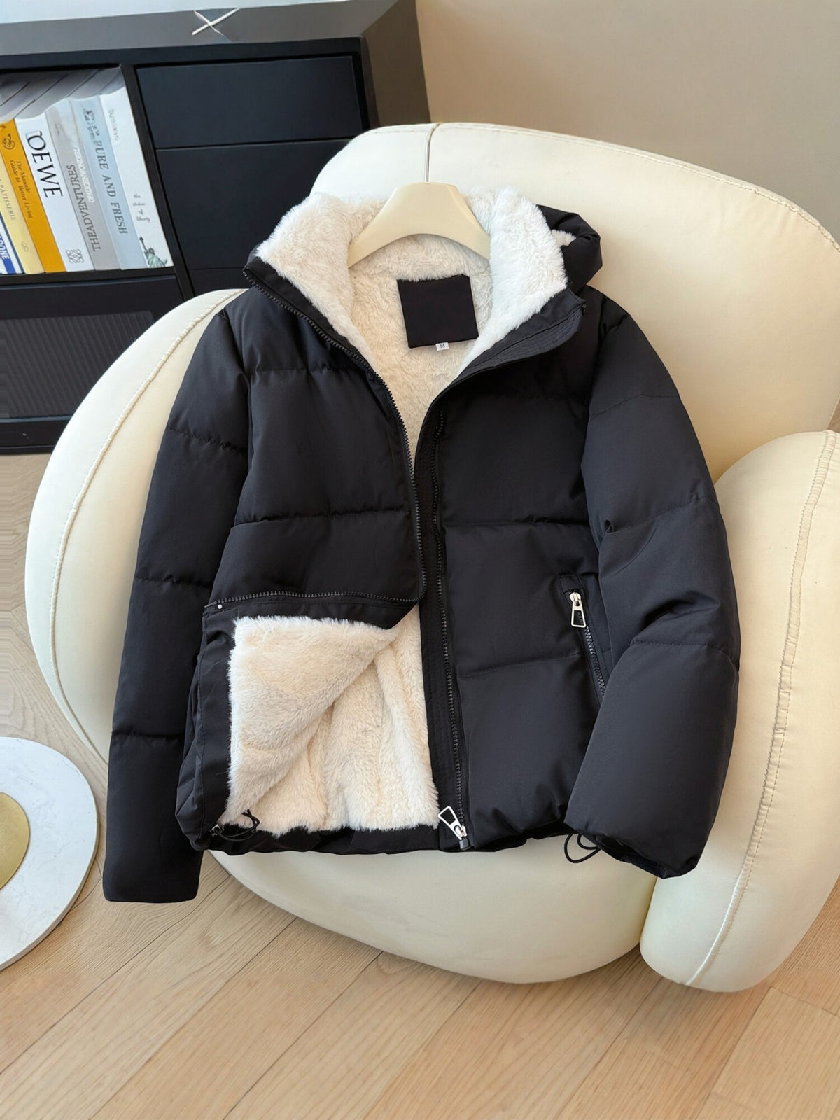 Padded winter puffer jacket with a fleece lined hood and two zippered front pockets