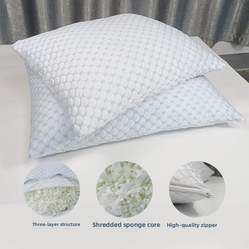 Rectangular memory foam bed pillow with a quilted cooling knit cover with the shredded foam fill exposed