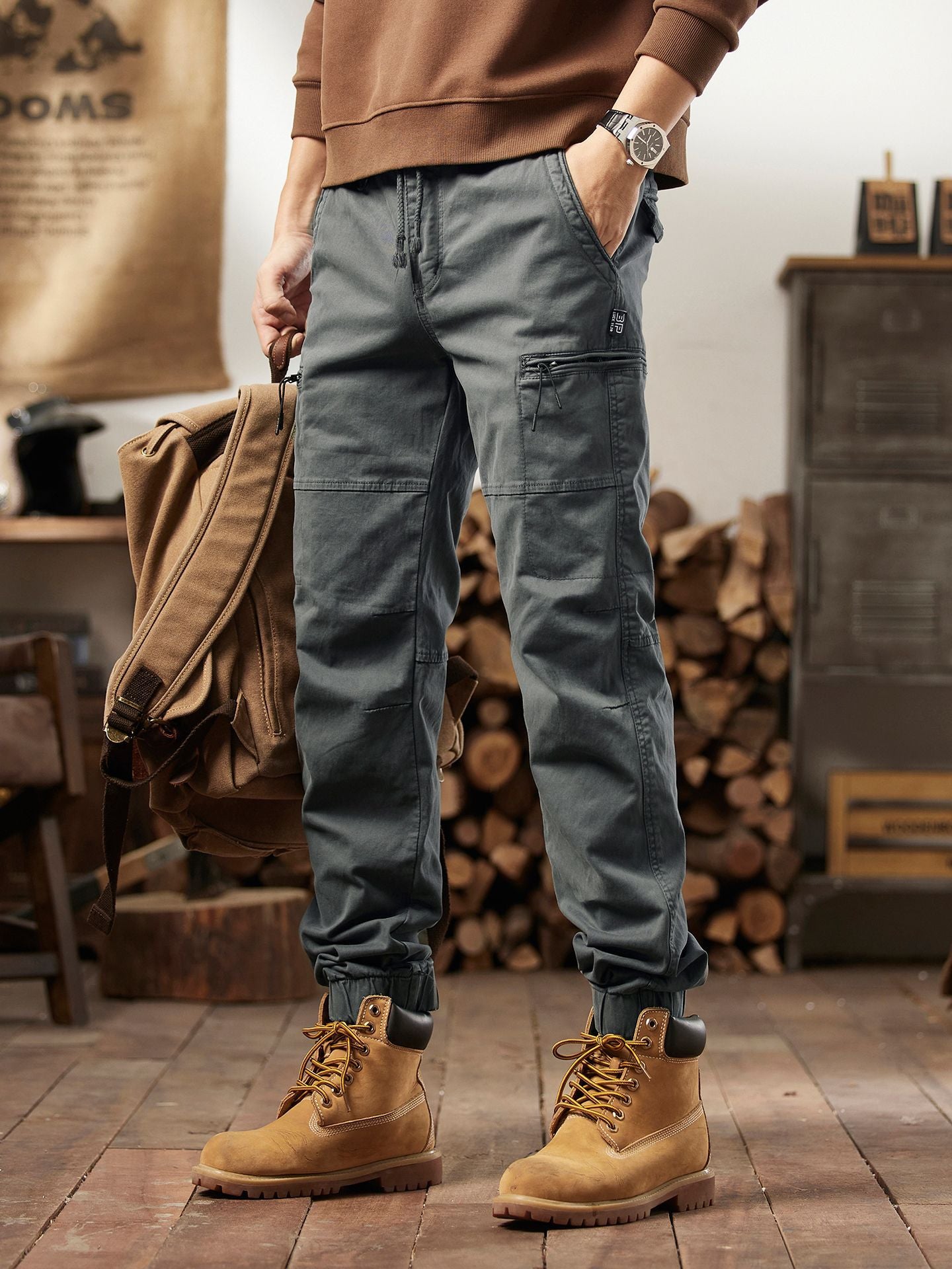 Side profile of relaxed straight-leg cargo pants showing flap thigh pocket