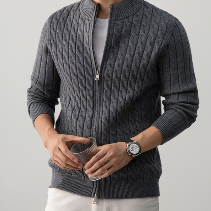 Raised cable knit texture detail of the thick mens sweater
