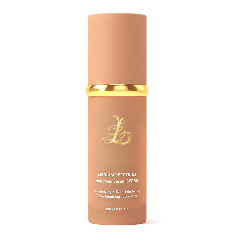 Matte peach pump bottle of color changing liquid foundation serum standing upright on a plain white studio background