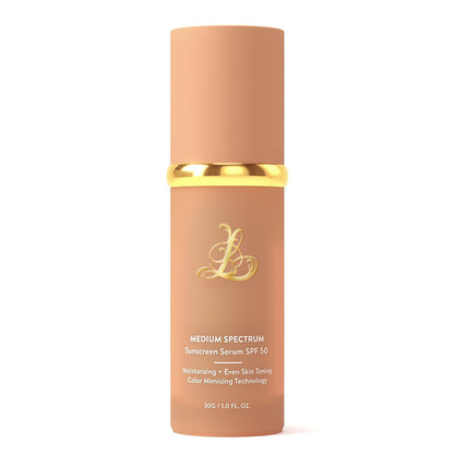 Matte peach pump bottle of color changing liquid foundation serum standing upright on a plain white studio background