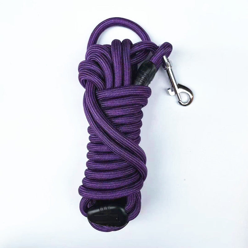 Round nylon pet long line coiled tightly beside its metal swivel trigger snap clip
