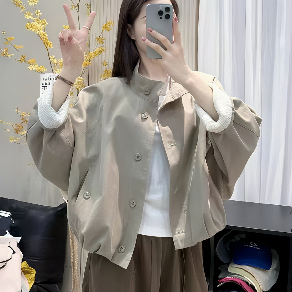 Womens casual button front short jacket in apricot, worn over a tee