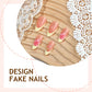 Close up of accent nails with a raised pink flower and faux pearl beads