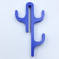 Blue resin three hook with three arms, seen from the front on a light background