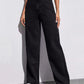 Front pocket view with hand resting at the high rise waistband