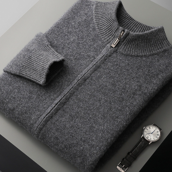 Dark grey wool knit cardigan folded flat showing the metal zip pull and ribbed collar, size S option