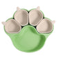 Green bear paw plate with four small beige cups, top view on a white background