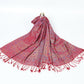 Maroon red paisley shawl with a blue border and maroon tassels spread on a white background