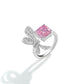 Bowknot ring in clear pave beside a radiant cut pink simulated diamond, adjustable band, white background