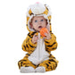 Baby in a striped tiger flannel romper with a white mane hood, holding an orange ball