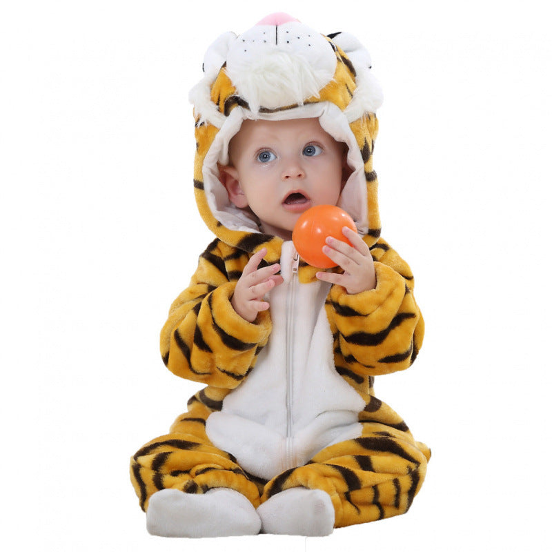 Baby in a striped tiger flannel romper with a white mane hood, holding an orange ball