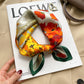 Cream and red poppy floral printed square scarf with a satin sheen and hemmed edges, shown displayed