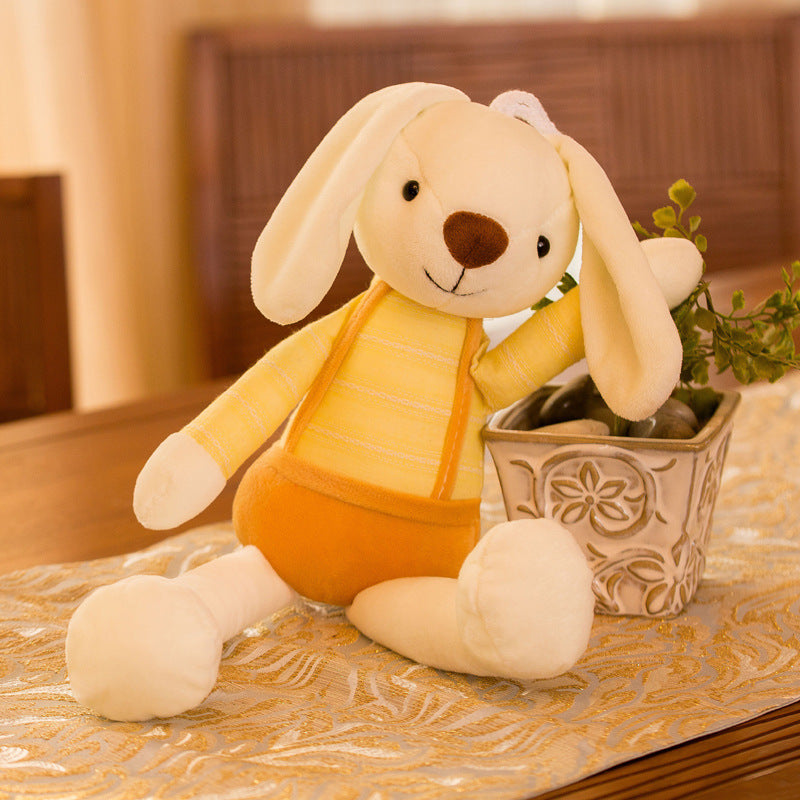 Cream plush rabbit in a yellow striped top and orange suspender shorts next to a planter, Yellow 70cm option