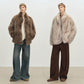 Long haired faux fur coat photographed on a model, dropped shoulder and full plain sleeve
