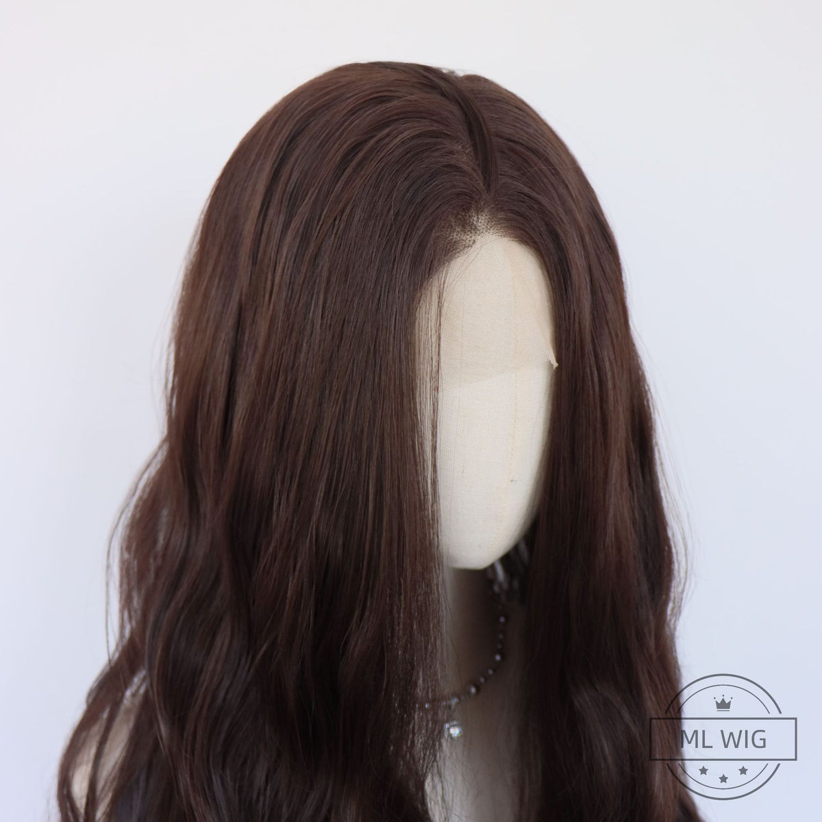 Close view of the 13x4 lace front on a mannequin showing the center part and dark brown hair