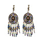 Bohemian vintage clip-on tassel drop earrings on a zinc alloy frame, handmade boho pair on white studio background