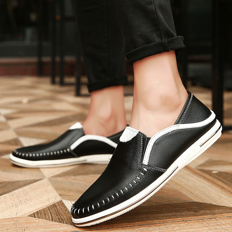 Mens leather slip on loafer with a perforated cutout upper and car stitch toe detail