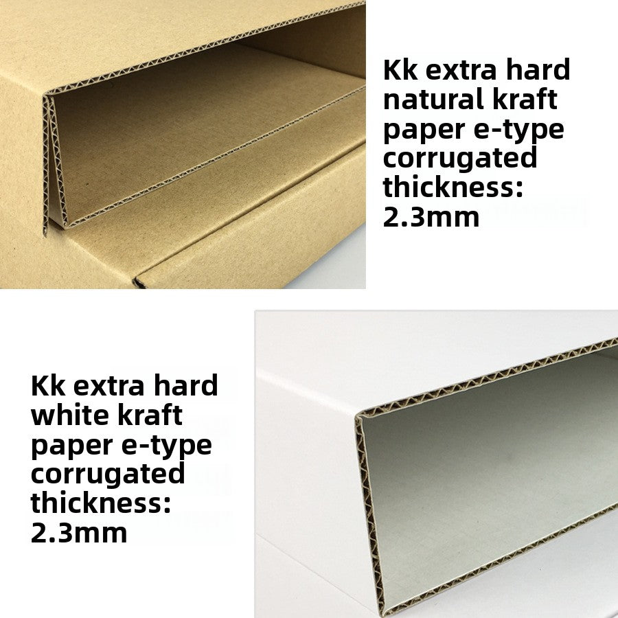 Cut corner of kraft and white corrugated board showing the 2.3 mm fluted layer between two paper faces