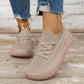 Khaki knit mesh slip-on sneakers with dusty pink crackle soles worn with ripped jeans and a gold anklet