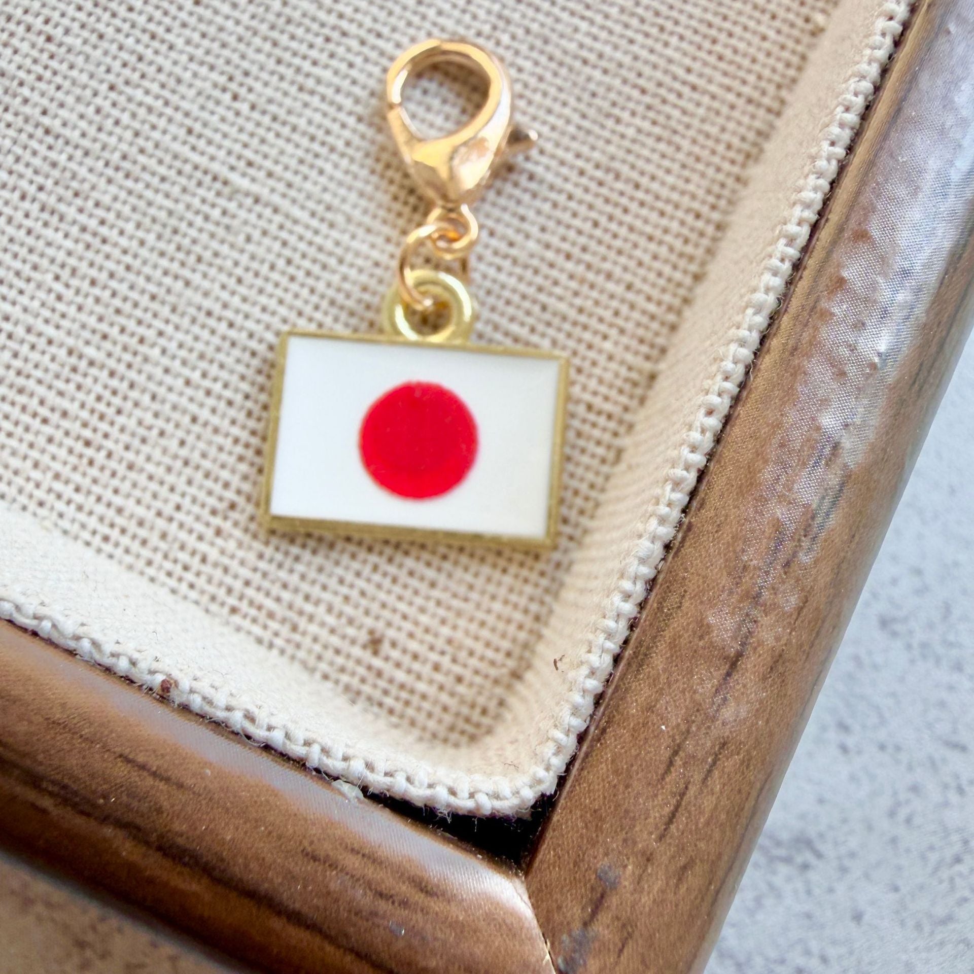 Japan enamel country flag keychain charm on a gold tone lobster clasp for keys and bags