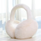 White Plush Band foldable plush winter earmuffs, front three quarter view