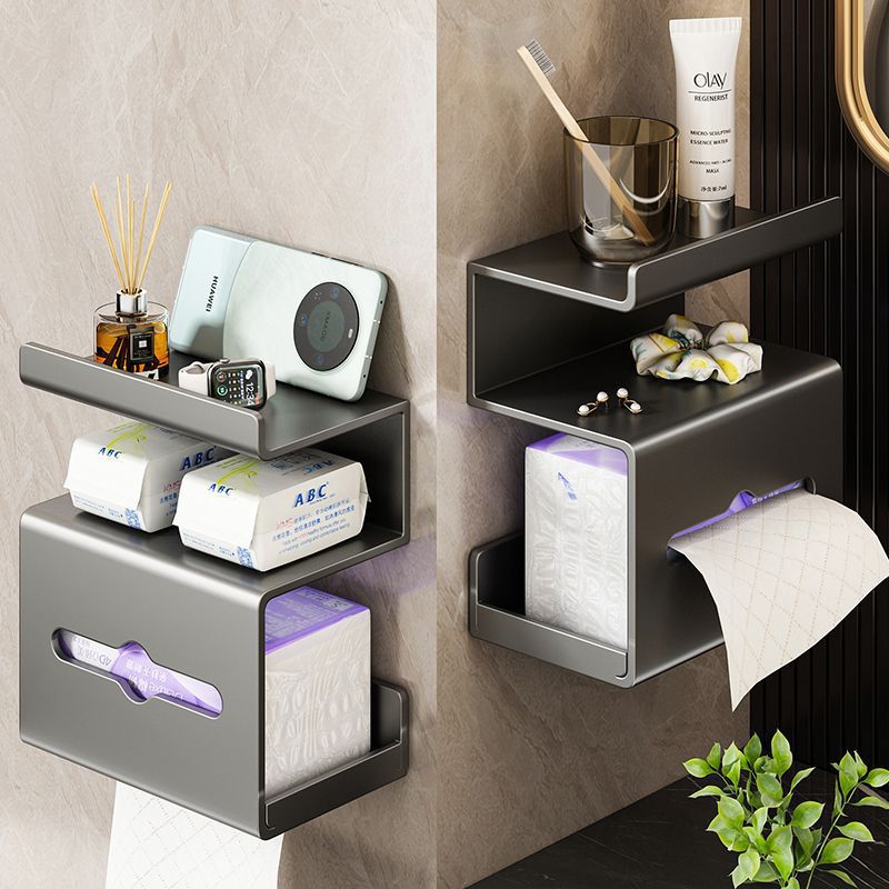 Gun metal tissue holder with a phone on the shelf and a tissue slot on the layer below